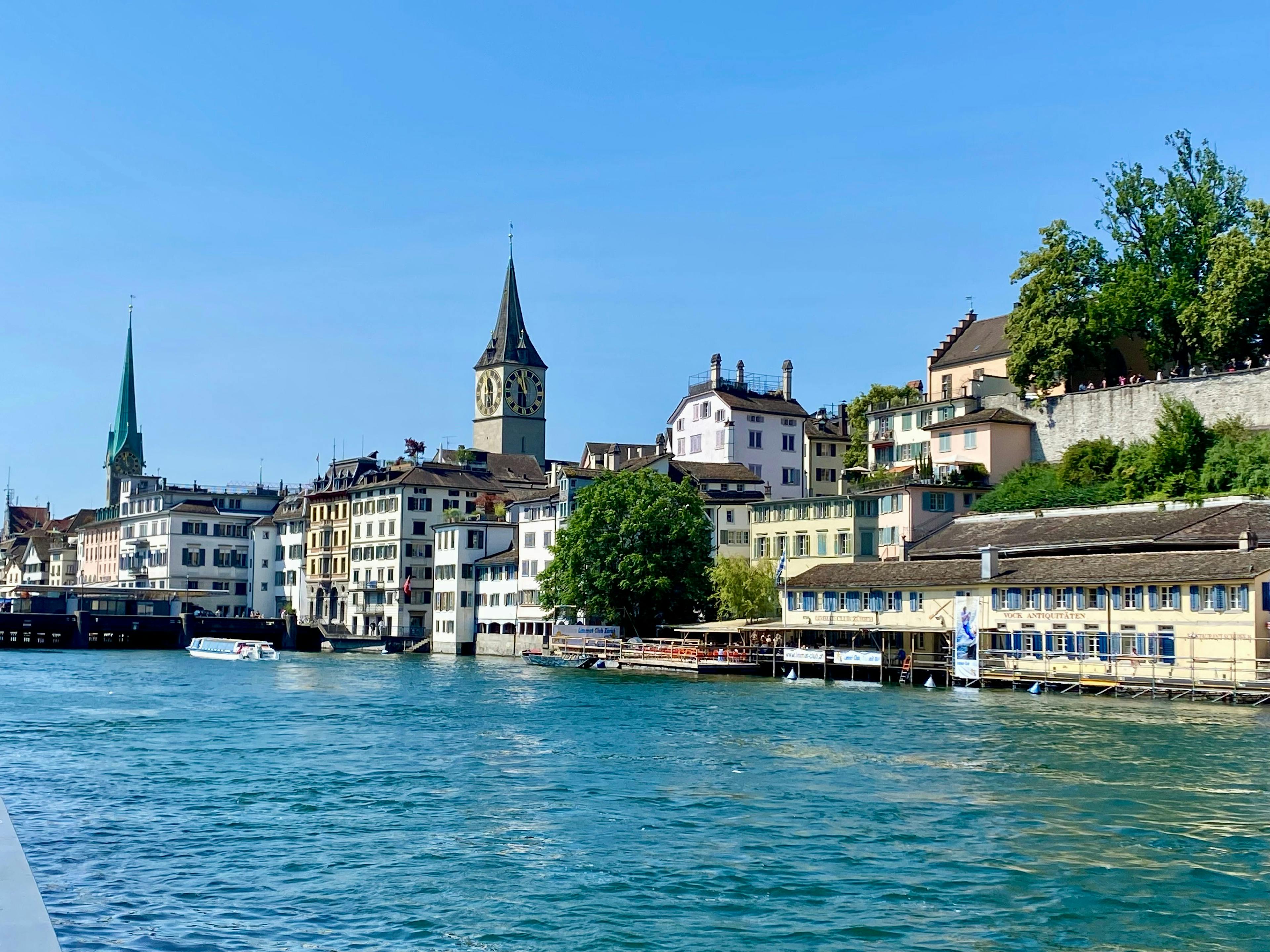 the river with old buildings and churches