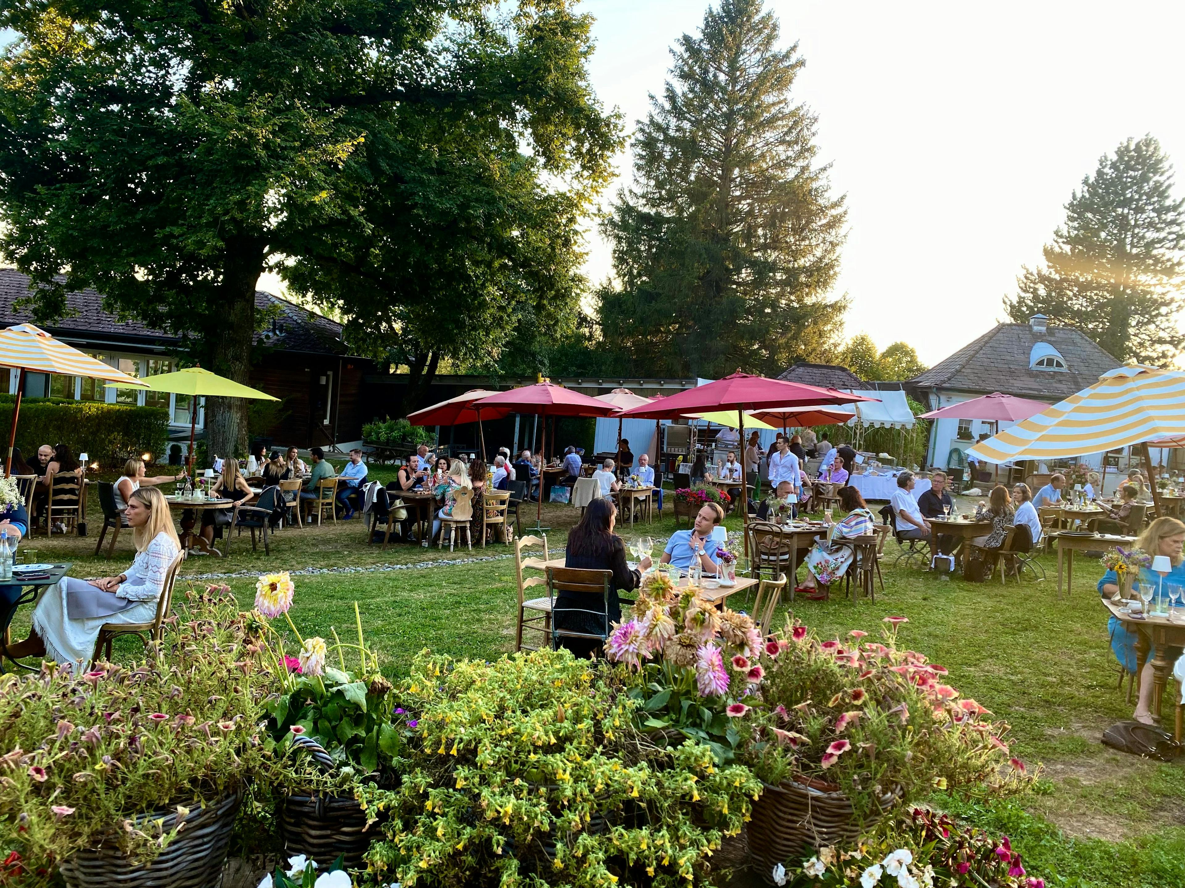 tables with umbrellas on grass